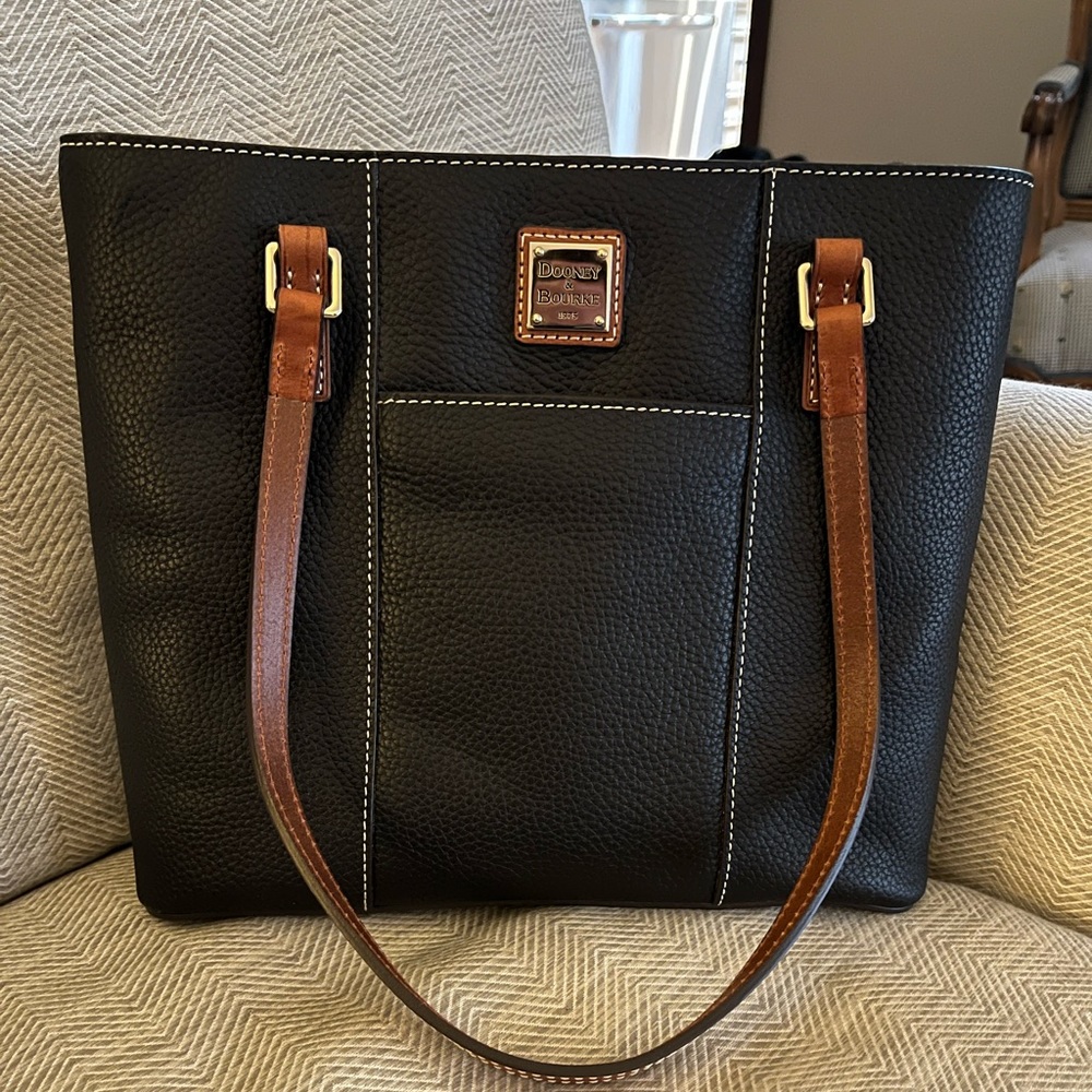 Beautiful black with brown leather handles. Brand new